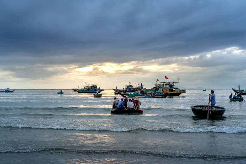 Fishing boats gathered off the Vietnamese coast at dawn