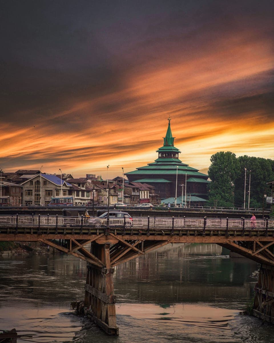 Wooden bridge over the Jhelum river in Srinagar at sunset